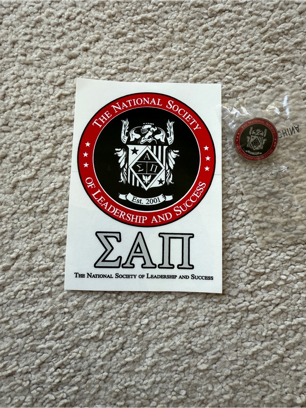 The National Society of Leadership and Success Sticker and Pin Red, Black, White